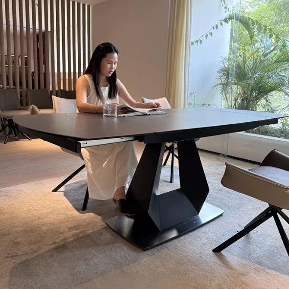 Table de salle à manger pivotante et extensible en forme de dalle de pierre avec pied central en acier