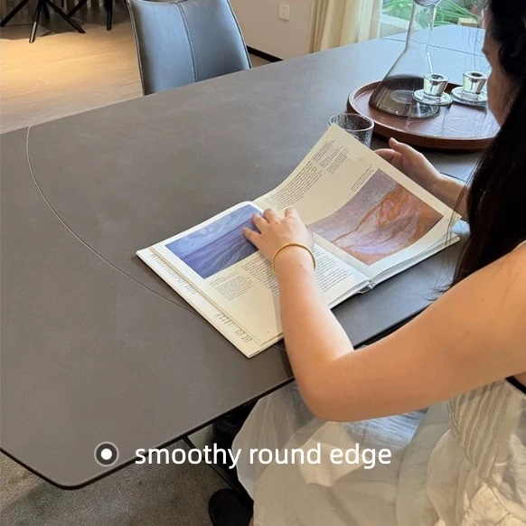 Table de salle à manger pivotante et extensible en forme de dalle de pierre avec pied central en acier