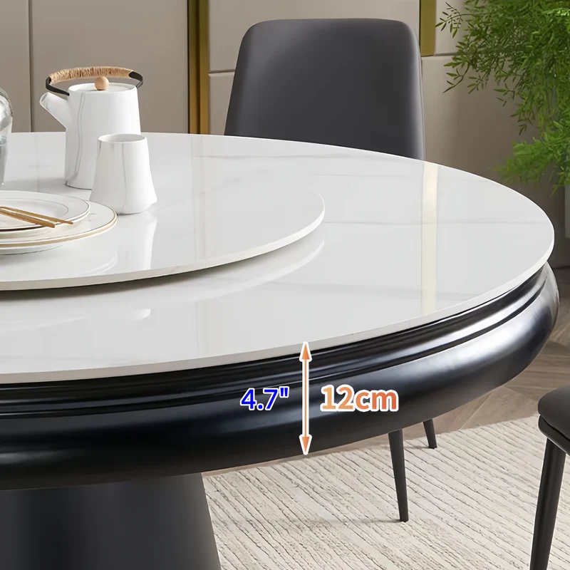 Table de salle à manger ronde avec plateau en pierre frittée et rallonge escamotable pivotante.