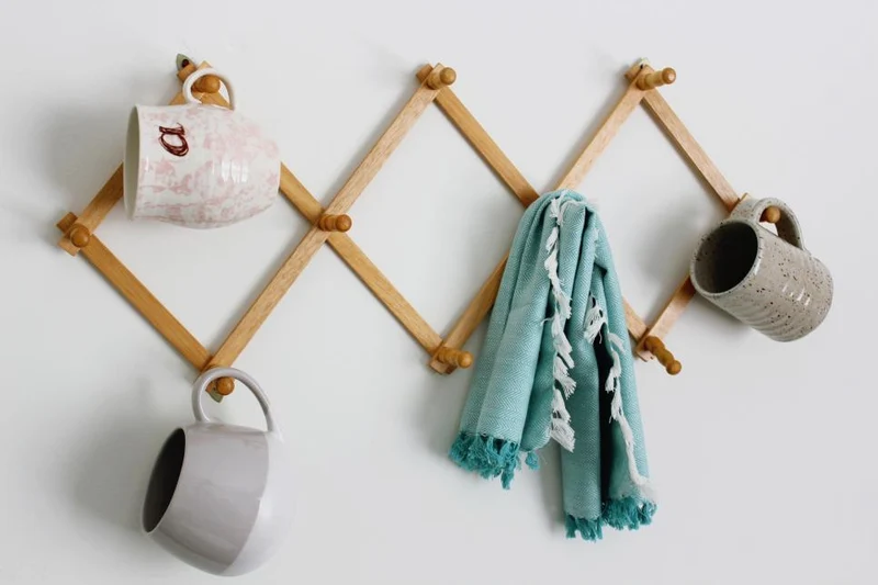 Cintre de porte-manteau accordéon en bois extensible
