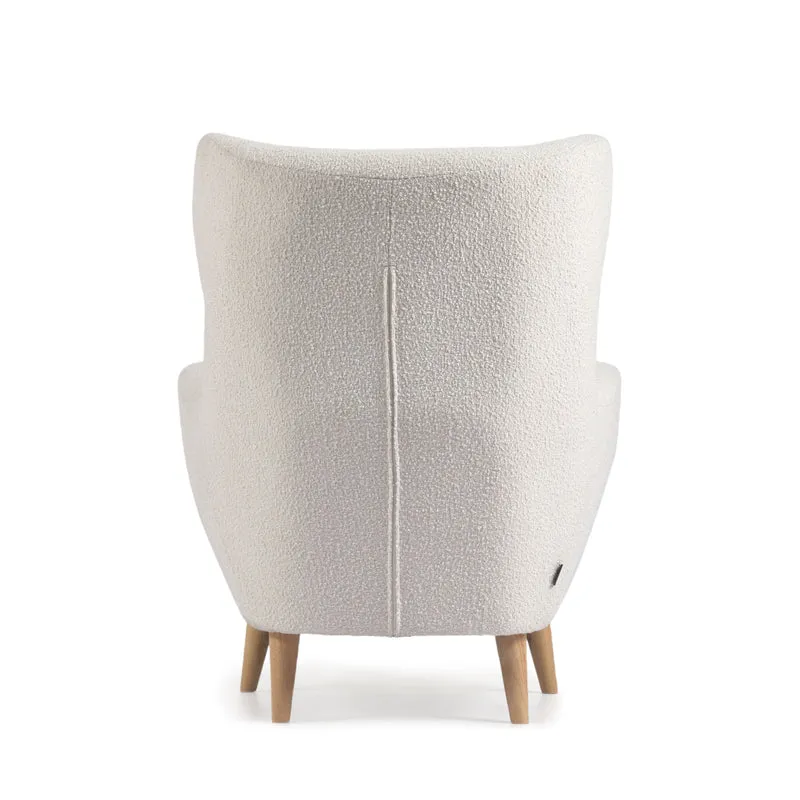 Patio armchair in white bouclé with solid, beech wood legs FSC Mix Credit