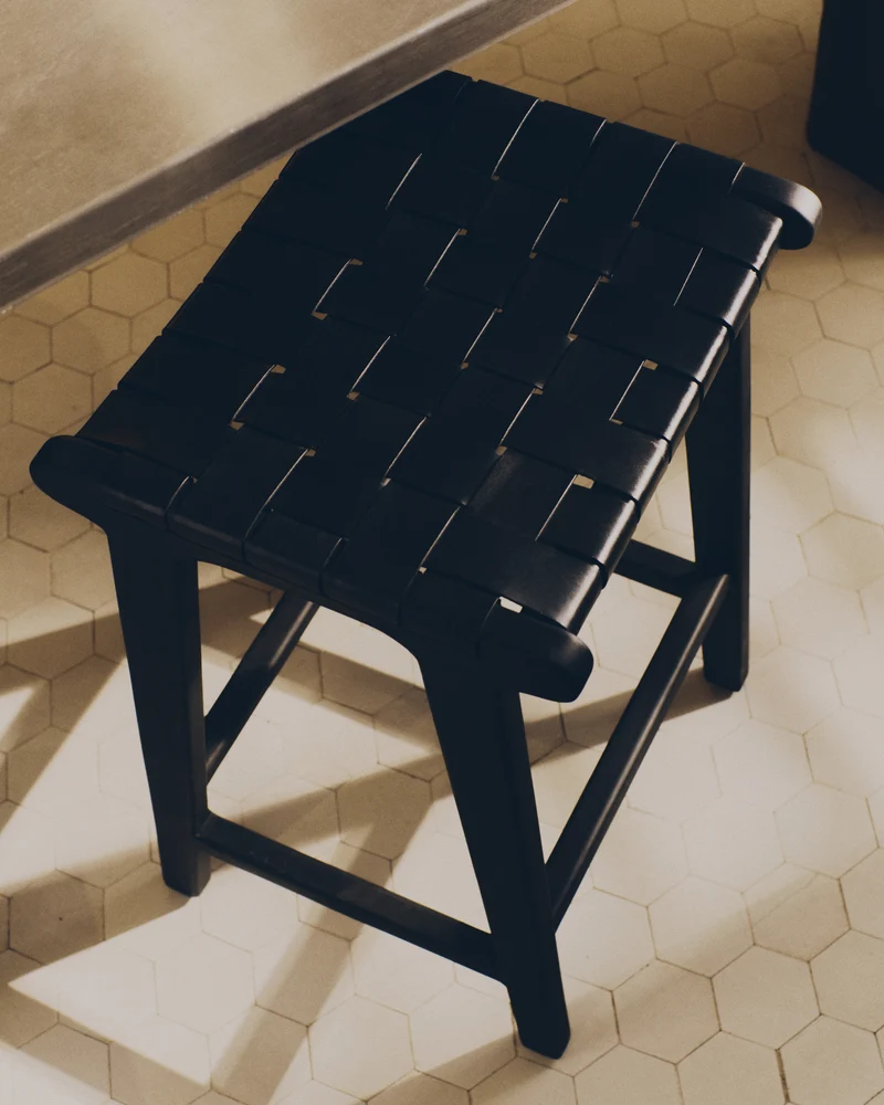 Calixta stool in leather and solid mahogany wood with black finish 67 cm