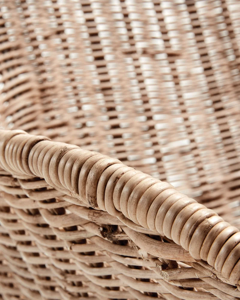 Chart chair made from rattan with black finished steel legs