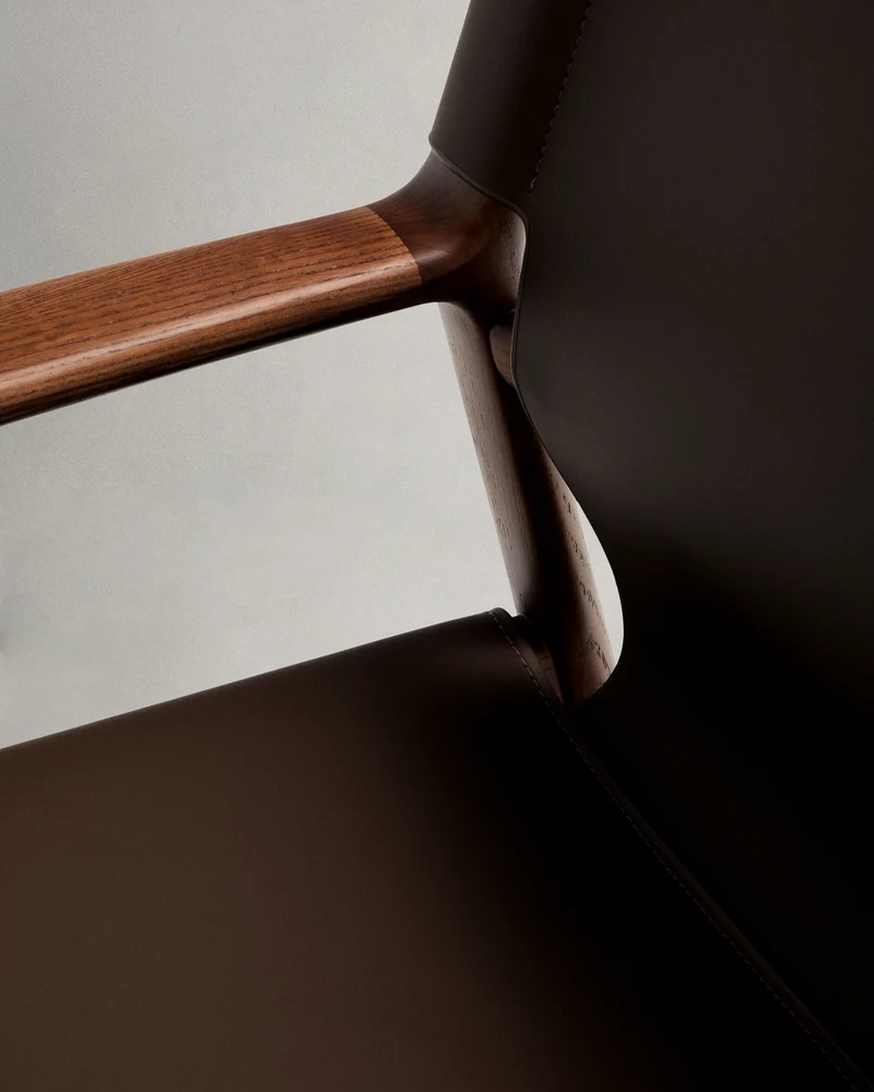 Jan armchair made of dark brown recycled leather fibres and FSC 100% solid ash wood with walnut-coloured finish