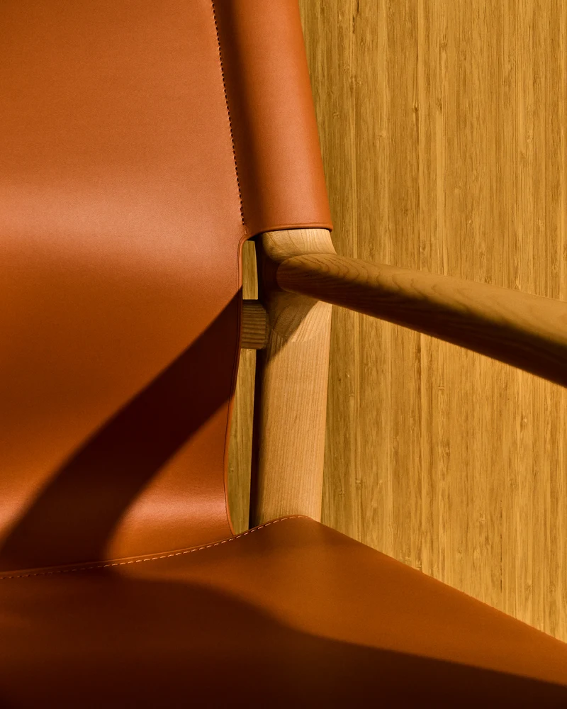 Jan armchair made of light brown recycled leather fibres and FSC 100% solid ash wood with natural tone finish